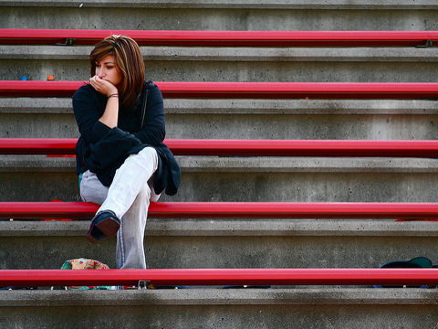 Lonely girl (Credit: Tom Woodward via Flickr)