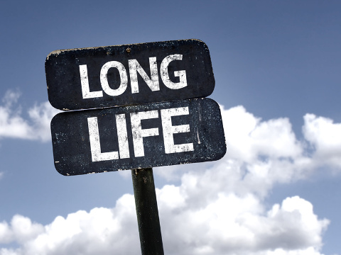 Long Life sign with clouds and sky background,