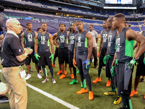 Defensive backs listen to instructions before they run a drill at the NFL football scouting combine, Monday, Feb. 29, 2016, in Indianapolis. (AP Photo/L.G. Patterson)