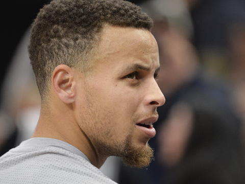 Golden State Warriors guard Stephen Curry walks to the bench during warm-ups before an NBA basketball game against the San Antonio Spurs, Saturday, March 19, 2016, in San Antonio. San Antonio won 87-79. (AP Photo/Darren Abate)