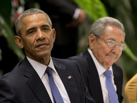 President Barack Obama, left, listens to a live band along with Cuba's President Raul Castro during a state dinner at the Palace of the Revolution in Havana, Cuba, Monday, March 21, 2016. Laying bare a half-century of tensions, Obama and Castro prodded each other Monday over human rights and the long-standing U.S. economic embargo during an joint news conference. (AP Photo/Rebecca Blackwell)
