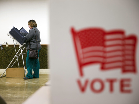 A voter casts her ballot in the primary election Tuesday, March 15, 2016, at an American Legion Hall in Marengo, Ohio. (AP Photo/Matt Rourke)