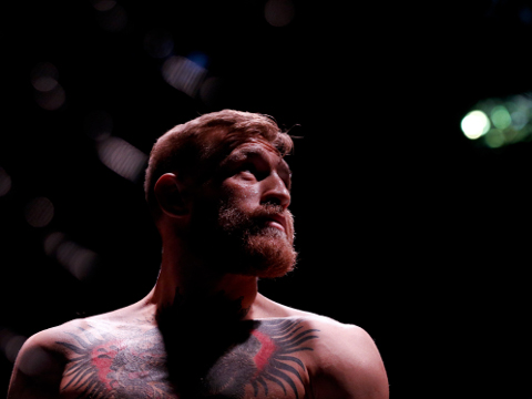 Conor McGregor looks on before fighting Jose Aldo in a featherweight championship mixed martial arts bout at UFC 194, Saturday, Dec. 12, 2015, in Las Vegas. (AP Photo/John Locher)