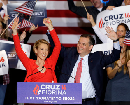 Republican presidential candidate Sen. Ted Cruz, R-Texas, joined by former Hewlett-Packard CEO Carly Fiorina, waves during a rally in Indianapolis, Wednesday, April 27, 2016, when Cruz announced he has chosen Fiorina to serve as his running mate. (AP Photo/Michael Conroy)