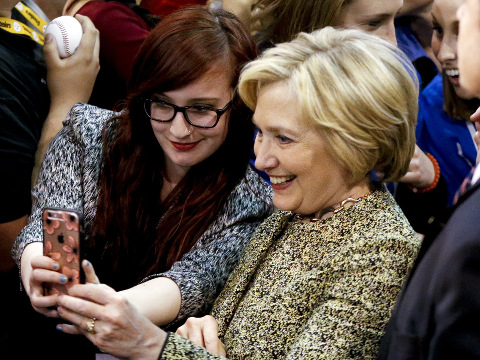 Democratic presidential candidate Hillary Clinton, right, takes aphoto with a supporter after a rally at Carnegie Mellon University on a campaign stop, Wednesday, April 6, 2016, in Pittsburgh. (AP Photo/Keith Srakocic)