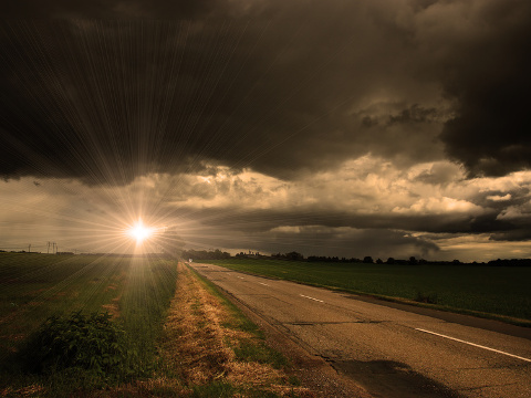 Asphalt road and dark storm clouds over it (Credit: Balazs Kovacs Images via fotolia)