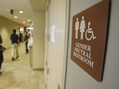 FILE- In this Aug. 23, 2007 file photo, a sign marks the entrance to a gender neutral restroom at the University of Vermont in Burlington, Vt. For opponents of transgender rights, a favorite line of attack is to oppose policies that would allow people to choose whether to use a men's or women's bathroom based on gender identity.(AP Photo/Toby Talbot, File)