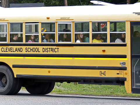 In this May 13, 2015 file photograph, an integrated group of Cleveland, Miss., public school students ride the school district bus on their way home following classes. A federal judge ruled on a desegregation case, Friday, May 13, 2016, that the Cleveland school district must merge its high schools and middle schools to achieve racial desegregation. (AP Photo/Rogelio V. Solis, File)