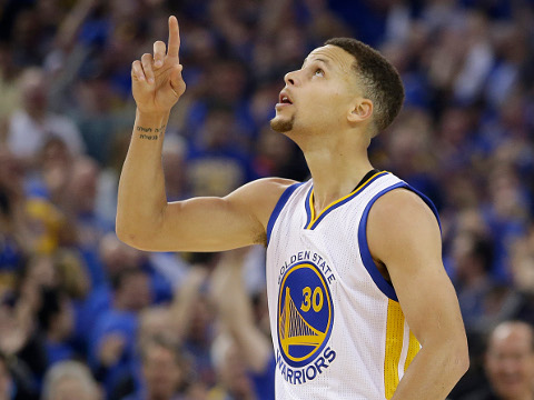 Golden State Warriors guard Stephen Curry (30) reacts after making a three point basket during the first half of an NBA basketball game against the Memphis Grizzlies in Oakland, Calif., Wednesday, April 13, 2016. (AP Photo/Marcio Jose Sanchez)