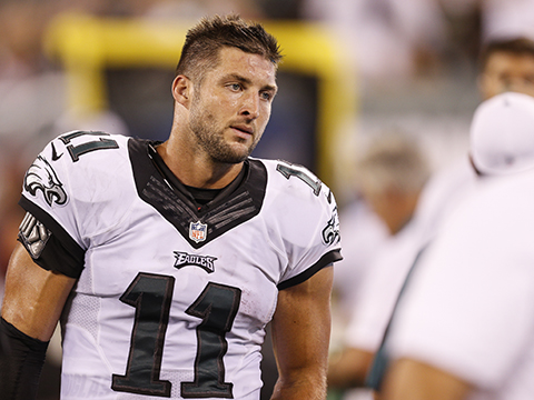 Philadelphia Eagles quarterback Tim Tebow #11 looks on from the bench area of the sideline during the preseason NFL game between the Philadelphia Eagles and the New York Jets on September 3rd 2015 in East Rutherford, N.J..