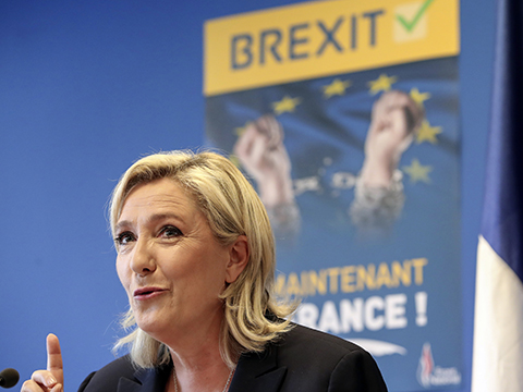 French far-right leader Marine Le Pen speaks during a press conference at the National Front party headquarters in Nanterre, outside Paris, Friday, June 24, 2016. Le Pen says pro-independence movements in the European Parliament will meet soon to plan their next move after the British vote to leave the European Union. Poster behind reads: Brexit. And now, France.