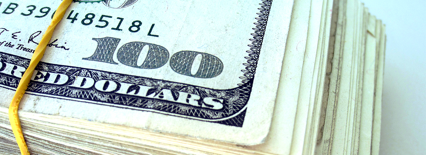 A pile of $100 dollar bills