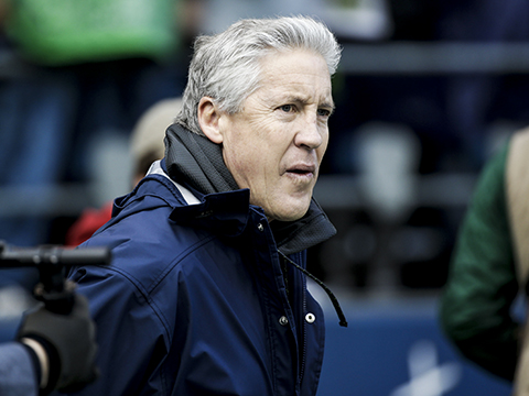 Seattle Seahawks head coach Pete Carroll watches warm up's before the NFL football NFC Championship game against the Green Bay Packers Sunday, Jan. 18, 2015, in Seattle.