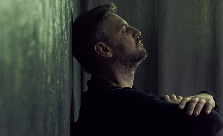 A man sits with his back and head against a wall, arms crossed, suggestive of dealing with anxiety, stress, or depression. ©Photographee.eu/stock.adobe.com. Unfortunately, many people in a similar position may be asking themselves, "What does the Bible say about suicide?"