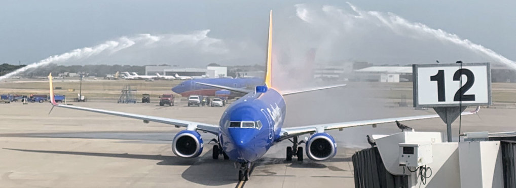 USAF Col. Roy A. Knight Jr.'s remains honored with Southwest Airlines water salute on August 8, 2019. Photo by Jackson Proskow (@JProskowGlobal) via Twitter.