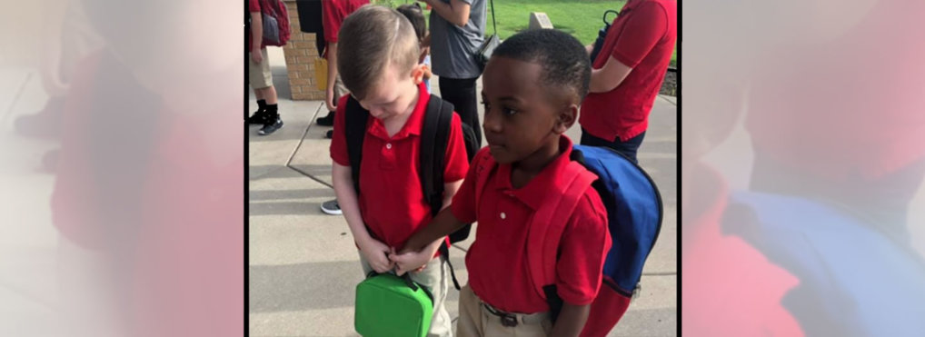 Second-grade student helps classmate with autism