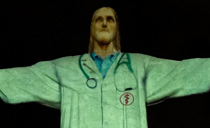 Christ the Redeemer statue illuminated to look like a doctor