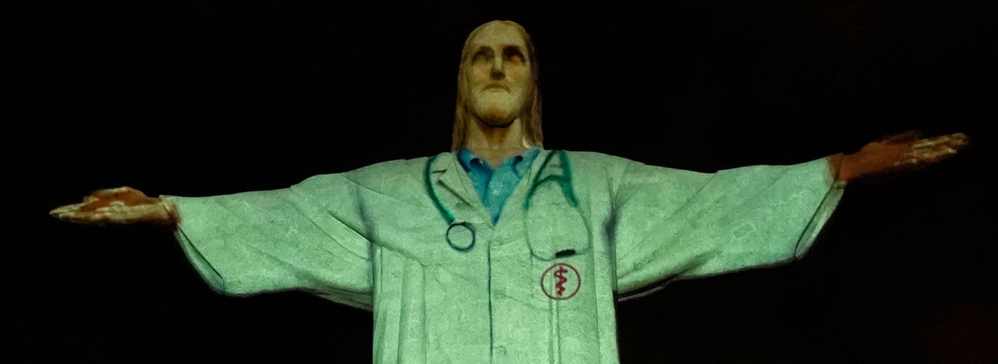 Christ the Redeemer statue illuminated to look like a doctor