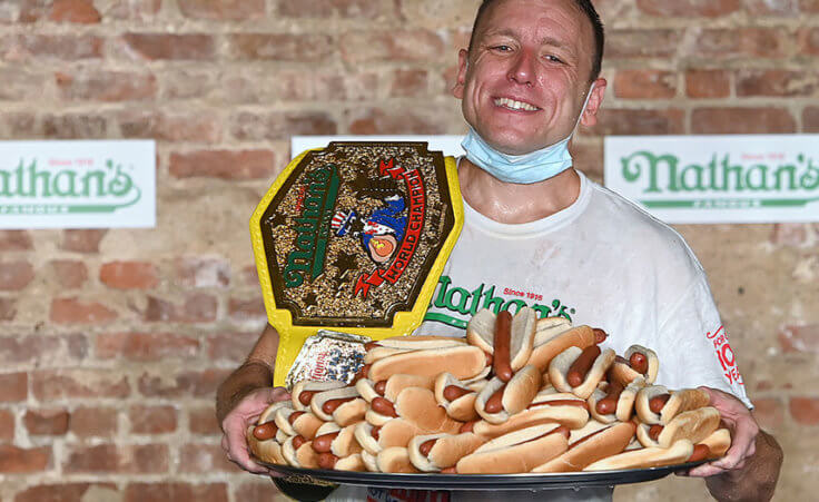 Joey Chestnut wins the Mustard Yellow Belt