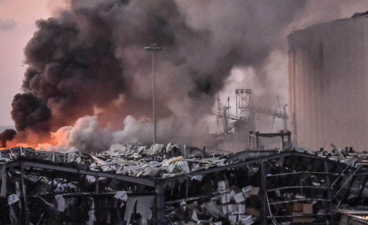 A military helicopter tries to put out a fire at the port after the explosion on August 4, 2020 in Beirut, Lebanon.