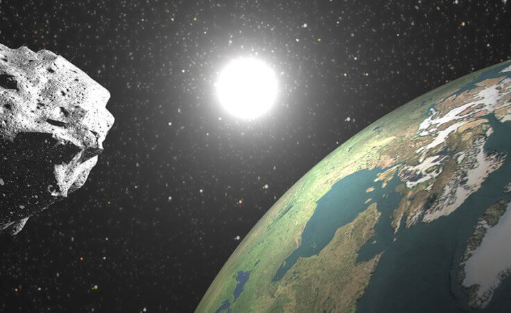 An asteroid floats near earth
