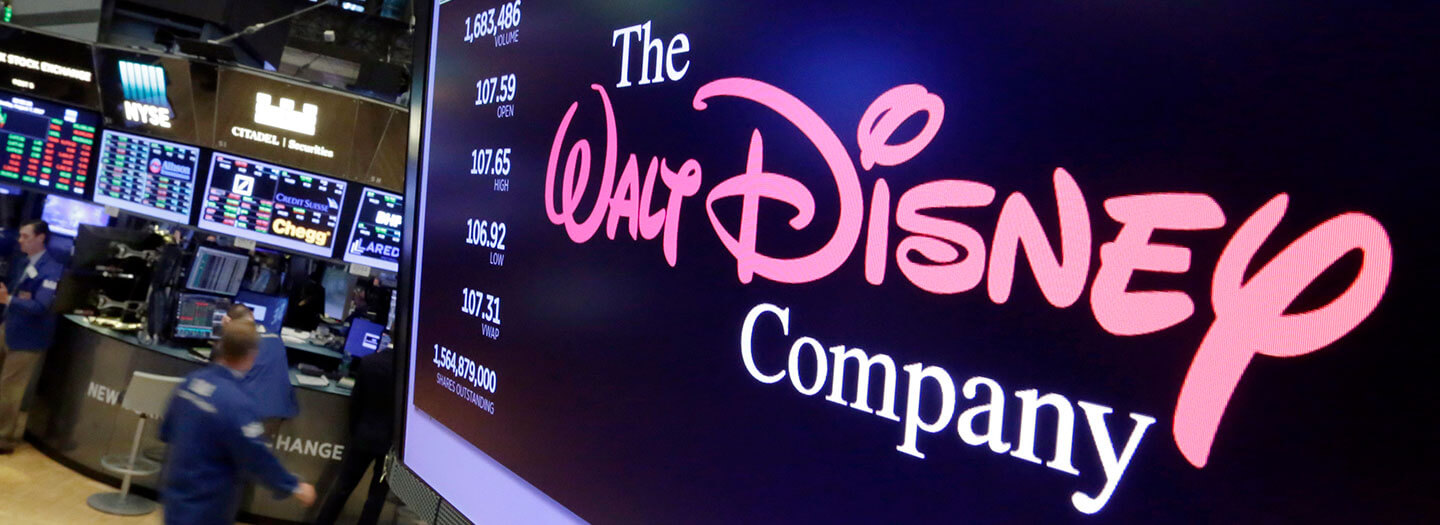 The Walt Disney Co. logo appears on a screen above the floor of the New York Stock Exchange
