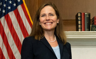 Supreme Court nominee Judge Amy Coney Barrett smiles during a meeting