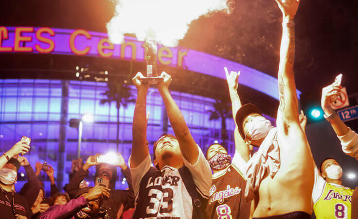 Los Angeles Lakers fans celebrate outside of Staples Center, Sunday, Oct. 11, 2020, in Los Angeles.