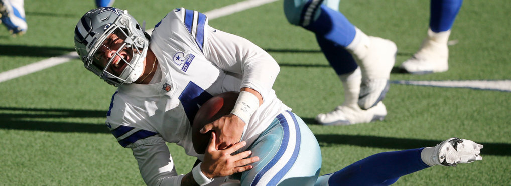 Dallas Cowboys quarterback Dak Prescott (4) is tackled by New York Giants cornerback Logan Ryan, rear, in the second half of an NFL football game in Arlington, Texas, Sunday, Oct. 11, 2020.