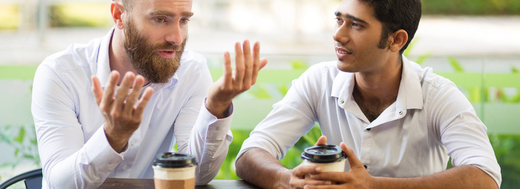 Two men have coffee