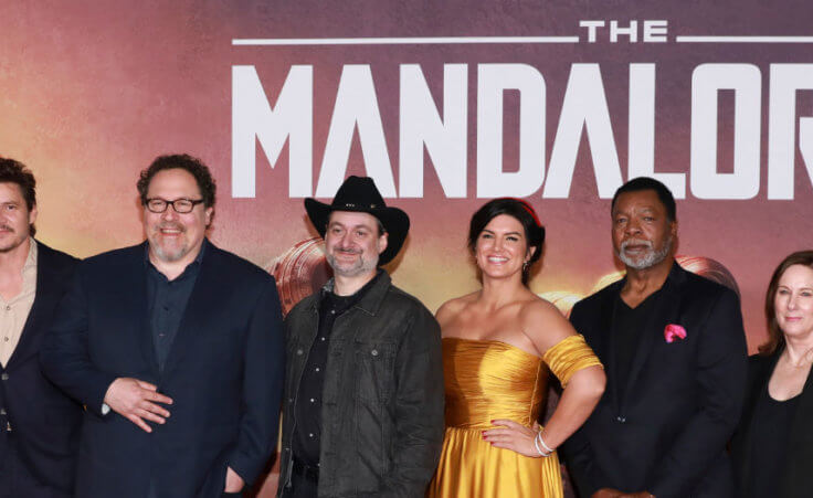 Ming-Na Wen, from left, Pedro Pascal, Jon Favreau, Dave Filoni, Gina Carano, Carl Weathers, Kathleen Kennedy, and Werner Herzog attend the LA Premiere of "The Mandalorian" at the El Capitan Theatre on Wednesday, Nov. 13, 2019, in Los Angeles.