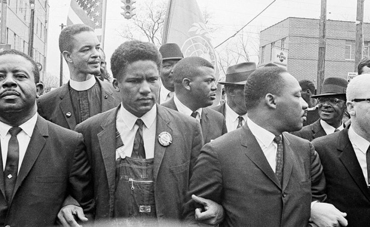 Dr. Martin Luther King King Jr., John Lewis, and others march to the courthouse in Montgomery, Alabama.