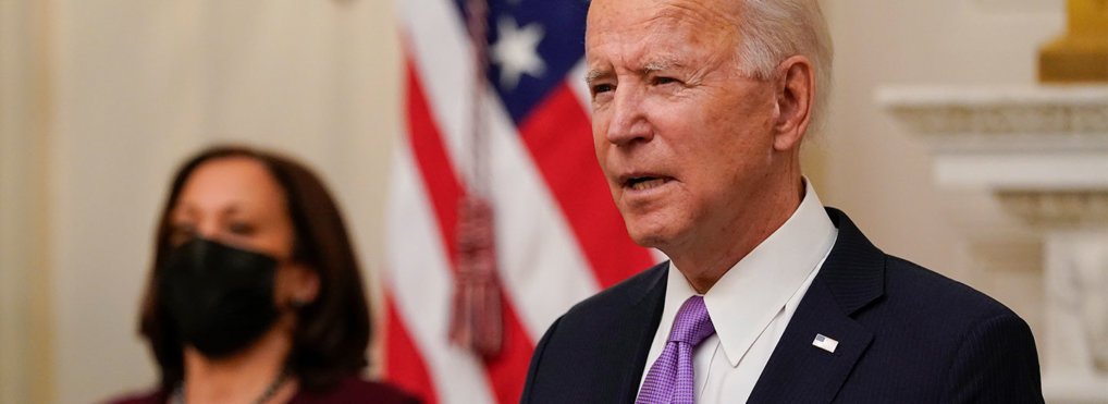 President Joe Biden speaks about the coronavirus, accompanied by Vice President Kamala Harris, in the State Dinning Room of the White House