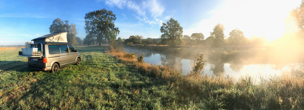 A van by a river