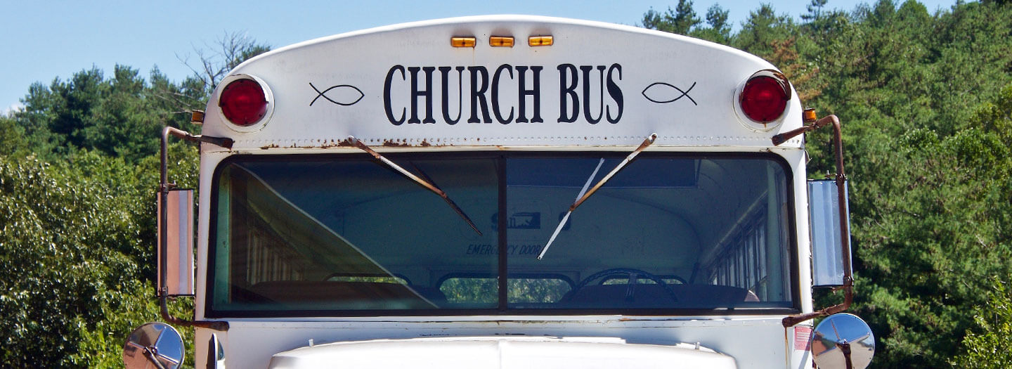 The front of a white church bus