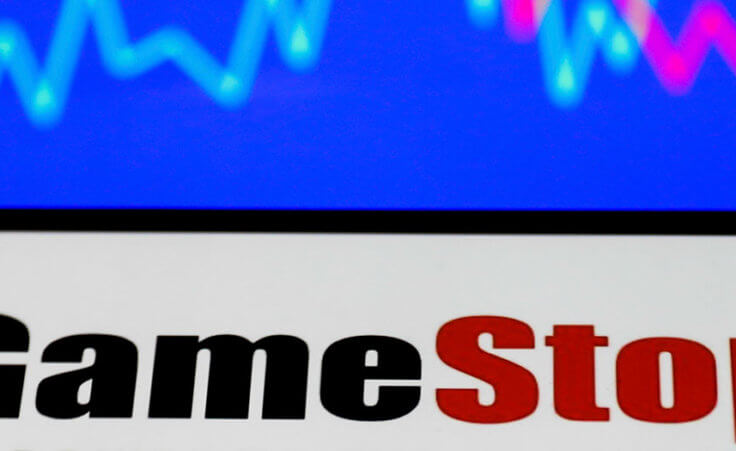 GameStop logo displayed on a phone screen and a illustrative stock chart on the background