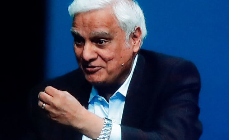 In this May 29, 2020 file photo, images of Ravi Zacharias are displayed in the Passion City Church during a memorial service for him in Atlanta.