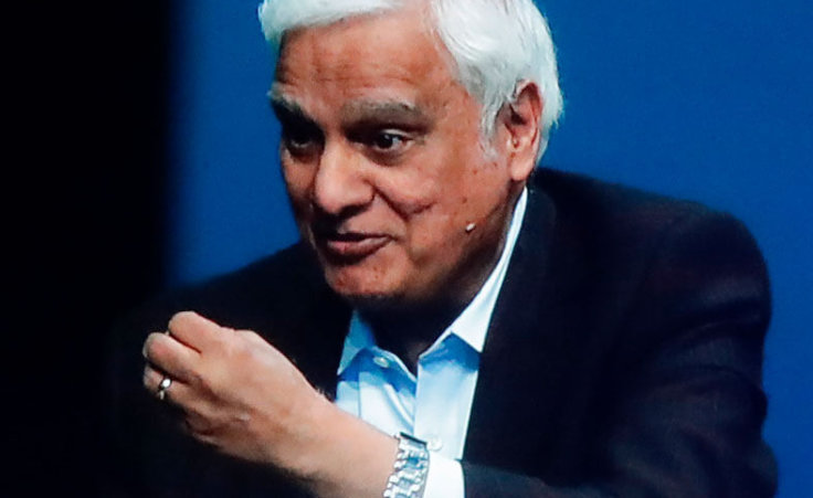 In this May 29, 2020 file photo, images of Ravi Zacharias are displayed in the Passion City Church during a memorial service for him in Atlanta.