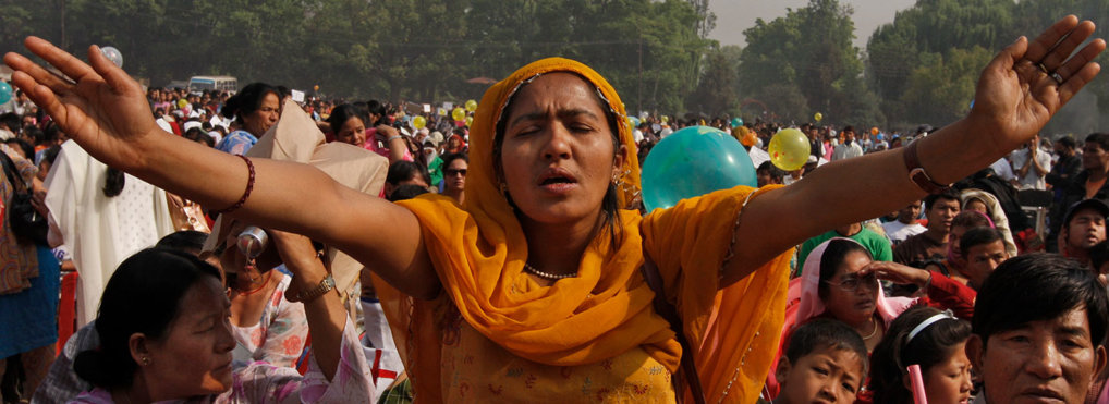Nepali Christians participate in a mass prayer in the open as they celebrate Easter Sunday in Katmandu, Nepal, Sunday, April 4, 2010.