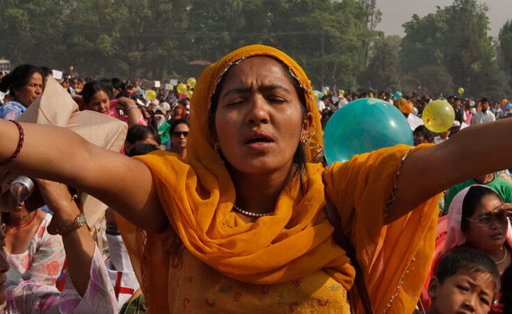 Nepali Christians participate in a mass prayer in the open as they celebrate Easter Sunday in Katmandu, Nepal, Sunday, April 4, 2010.