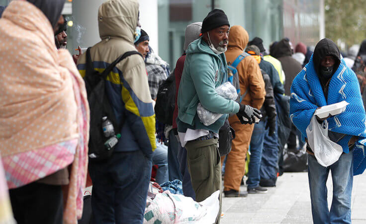 A line of more than 200 people formed outside at the George R. Brown Convention Center, in Houston, Sunday, Feb. 14, 2021