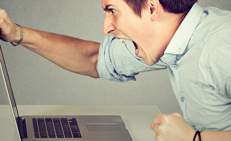 A man yells at his open laptop