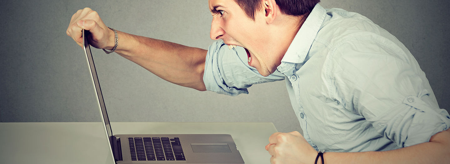 A man yells at his open laptop