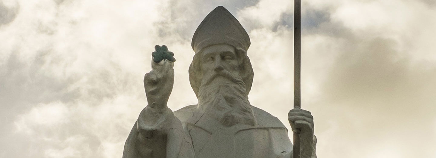 A statue of St. Patrick holding a shamrock
