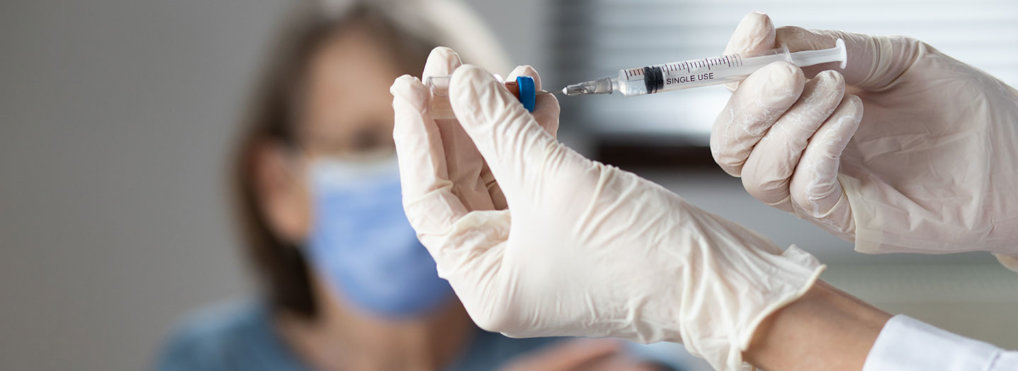 elderly woman getting coronavirus vaccine
