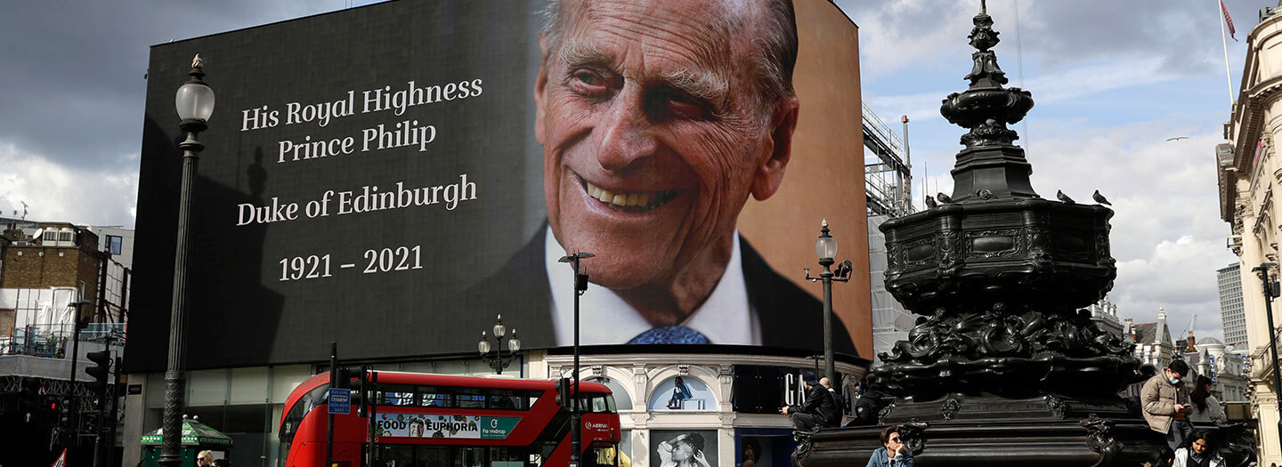 A tribute to Britain's Prince Philip is projected onto a large screen at Piccadilly Circus in London, Friday, April 9, 2021