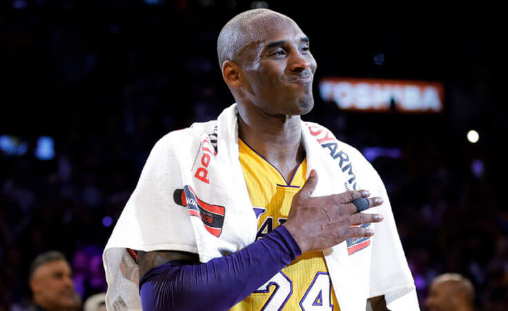 Los Angeles Lakers' Kobe Bryant pounds his chest after the last NBA basketball game of his career, against the Utah Jazz, Wednesday, April 13, 2016, in Los Angeles. (AP Photo/Jae C. Hong)