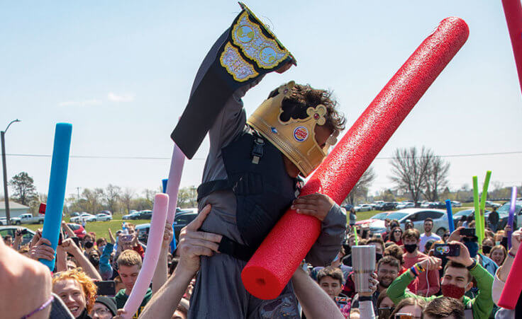 Lincoln native four-year-old Joshua Vinson Jr., top right, is lifted into the air after being declared the ultimate Josh after the Josh fight took place in an open green space at Air Park on Saturday, April 24, 2021, in Lincoln, Neb (Kenneth Ferriera/Lincoln Journal Star via AP)