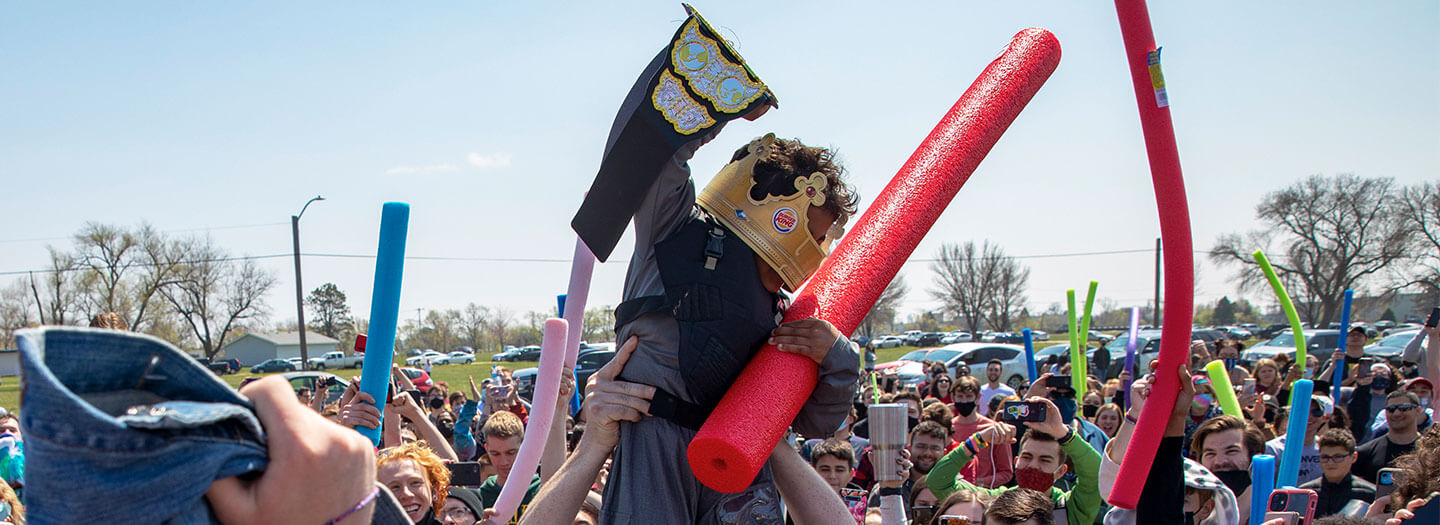Lincoln native four-year-old Joshua Vinson Jr., top right, is lifted into the air after being declared the ultimate Josh after the Josh fight took place in an open green space at Air Park on Saturday, April 24, 2021, in Lincoln, Neb (Kenneth Ferriera/Lincoln Journal Star via AP)