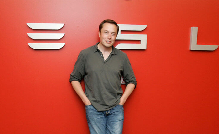 In this Tuesday, July 21, 2009 photo, Tesla CEO Elon Musk poses at Tesla headquarters in San Carlos, Calif. (AP Photo/Paul Sakuma)